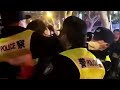 WARNING: GRAPHIC CONTENT - Shanghai police carry away demonstrator in COVID protests