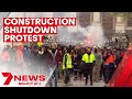 Riot police sent in to barricade Victoria's Parliament in a day of tradie protest fury | 7NEWS