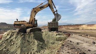 Caterpillar 365B Excavator Loading Trucks