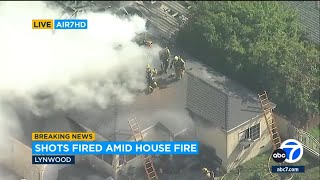 Shots fired as flames rip through Lynwood home