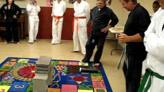 Mr. Harp (McAlester Tae Kwon Do 6th Dan Sabum Nim) breaking 3 concrete blocks with palm strike