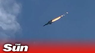 Russian fighter jet bursts into flames before crashing into lake