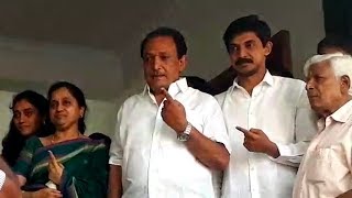 Father-son duo Krishnappa and Priya Krishna cast their votes