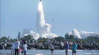 Spectators at Jetty Park in Cape Canaveral watch a Delta 2 rocket launching NASA’s GRAIL mission