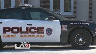 New Canaan police officer dragged by moving car