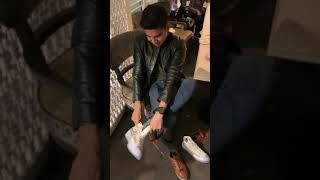 Syed Saddiq sedang mencoba sepatu kado dari my family