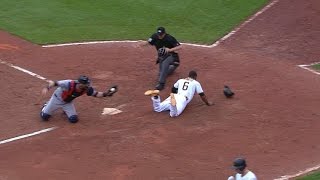 Marte steals home after a pickoff attempt