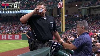 LAA@HOU: Umpire takes pitch off wrist, stays in game