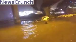 Onlookers save woman driver from dangerously flooded road