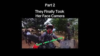 African Police try to take camera from a women traveling from the Netherlands on a motorcycle