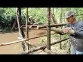 build a shelter on the river bank camping heavy rain and thick fog