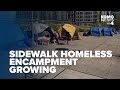 Encampment on sidewalk between South Lake Union and Seattle Center continues to grow