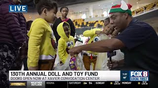 Fox 8's Juan Kincaid checks in with kids getting gifts at T-P Doll and Toy Fund giveaway
