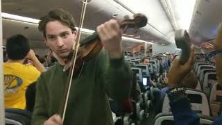 Stratford high school students play instruments on United flight