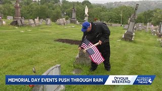 Volunteers place flags on veterans' graves at Pennsylvania cemetery for Memorial Day