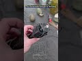 russian soldier inspects diy grenade from drone attack