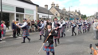 Scotland the Brave as Burntisland Pipe Band march along street to 2023 Pitlochry Highland Games