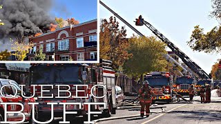 *PRE-ARRIVAL* Four alarm fire takes down roof of a residential building in Ahuntsic.