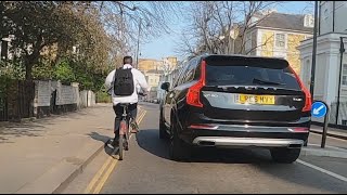 Chelsea tractor close-pass cyclist meters before turning. Too stressed by the school run LR66 MVY?