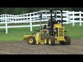 laser grader 106 p equipped with harley rake attachment and grade control package