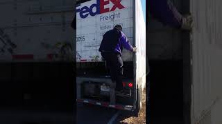 driver climbing up into trailer