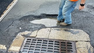 Oblivious Drivers Hit Massive Pothole