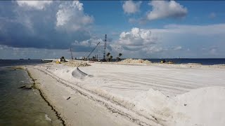 Family has beach day on closed Sanibel Causeway Beach