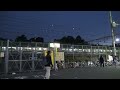 夜の鶯谷駅の北口広場前を通過していく上野東京ライン常磐線特急ひたちe657系のラッピング列車