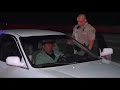 driver passed out behind the wheel inside car stopped in middle of san diego freeway