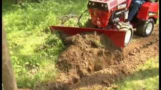 Steiner 440 Tractor with Power Angle Blade Attachment