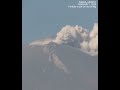 drone of smoke billowing from peak crater as mexico s popocatepetl volcano erupts