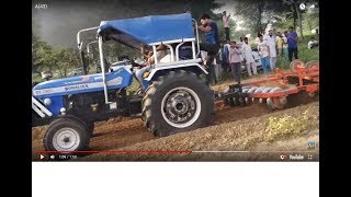 Sonalika Di-750 III tractor pulling 2 harrow