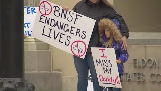 Loved ones of railroaders protest new attendance policy outside federal courthouse