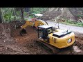 excavator digging excavating cliffside road to make it wider