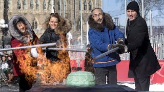 Justin Trudeau helps unveil Centennial Flame’s Nunavut crest