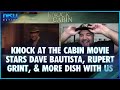 Knock at the Cabin Movie Stars Dave Bautista, Rupert Grint, Jonathon Groff, & More Dish With Us