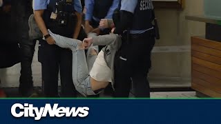 RAW: At least three people escorted out of Toronto City Hall