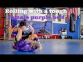 Rolling(narration) with a female purple belt