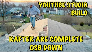 Youtube Studio Garage Addition Build.Roof rafters complete, laying down OSB. What’s next?