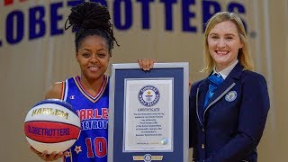 Most Basketball Under the Leg Tumbles in One Minute by a Female | Harlem Globetrotters
