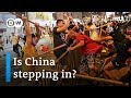 China's central government threatens Hong Kong protesters | DW News