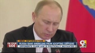 Russia bans Americans from adopting orphans.