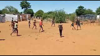 Young boys play soccer in Gobabis