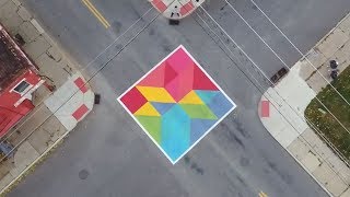 Local community turns street into work of art to improve safety