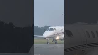 NetJets Embraer Phenom 300 taxiing on the runway after landing