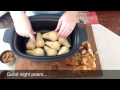 poached pears in the slow cooker spoon and saucer