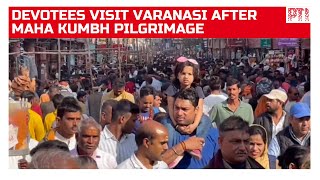 Devotees throng Varanasi after completing their Maha Kumbh pilgrimage