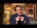 rebel moon interview charlie hunnam u0026 michiel huisman on zack snyder s cut calls ai