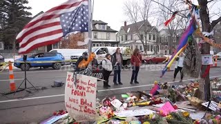 People pay their respects at make shift memorial for Renee Good