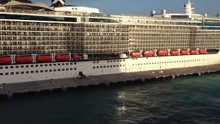 Missing Cruise Ships - pier runner with baby stroller on Celebrity Cruise Ship watched from NCL Epic